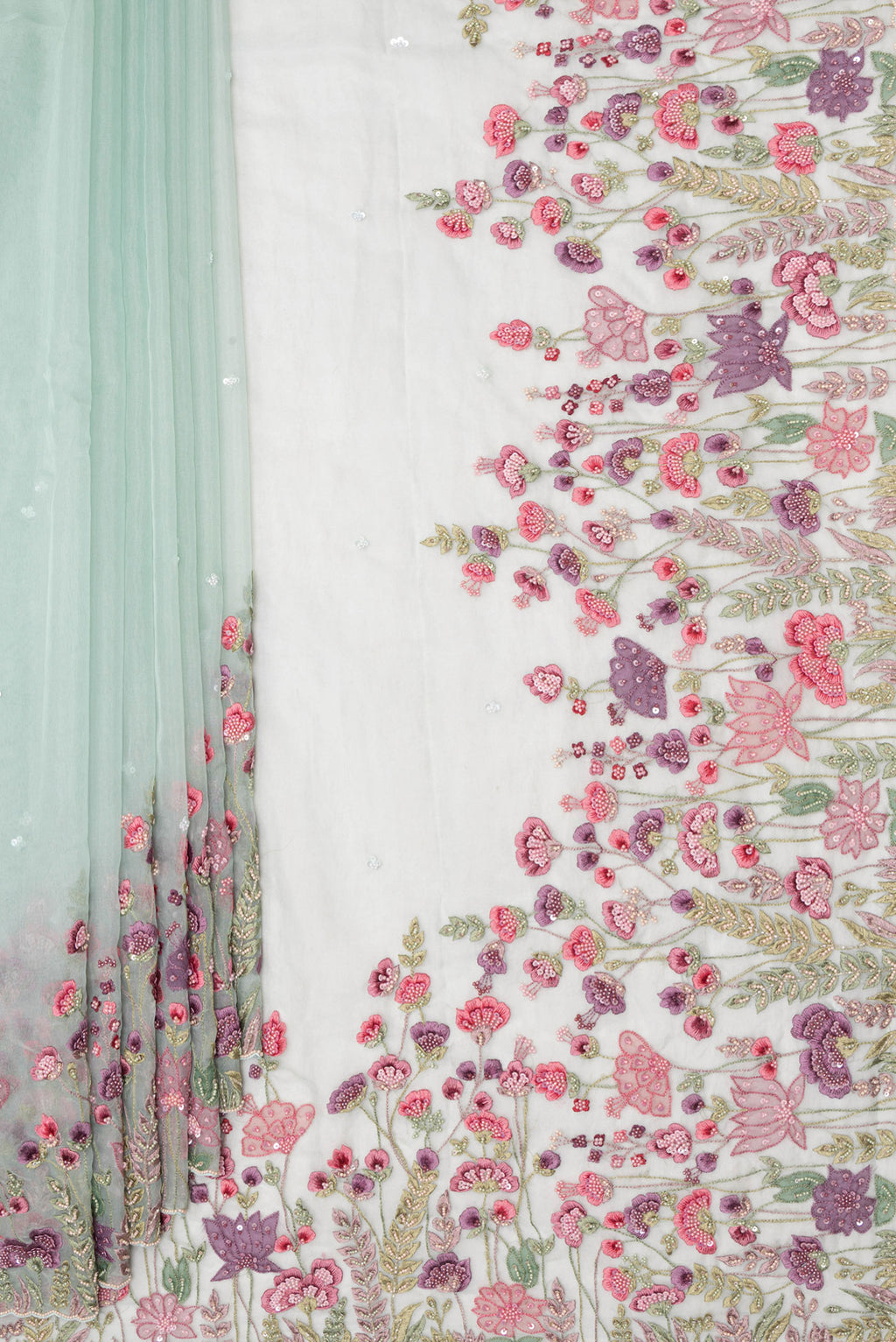 Pleats and pallu of Pure Silk Light Green Dual Tone Organza Saree with Embroidery on the body and Sequin Border. 