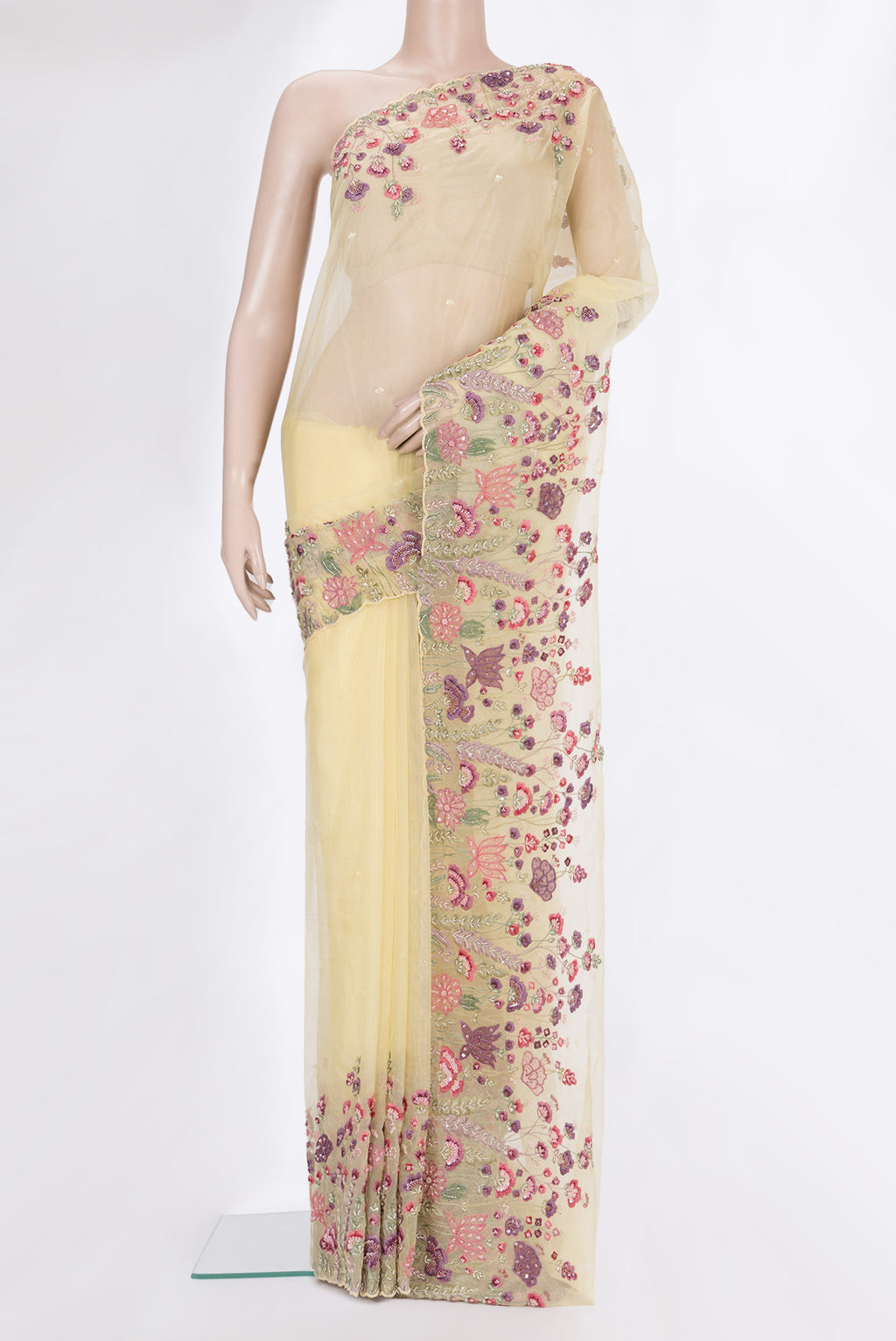 Lemon Yellow Organza Saree with Embroidered on the body and Embroidered Border.  displayed on a mannequin