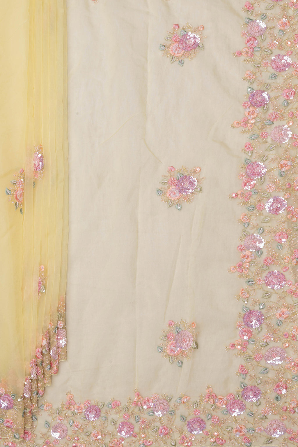 Pleats and pallu of Lemon Yellow Organza Saree with Embroidered on the body and Sequin Border. 