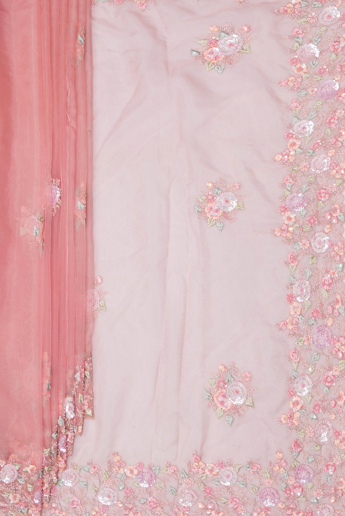 Pleats and pallu of Pure Silk Pink Dual Tone Organza Saree with Embroidery on the body and Sequin Border. 