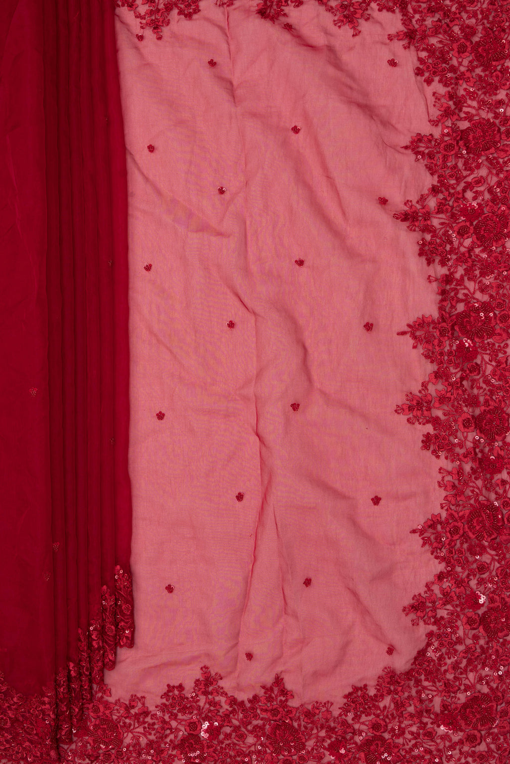 Pleats and pallu of Red Organza Saree with Embroidered on the body and Sequin Border. 