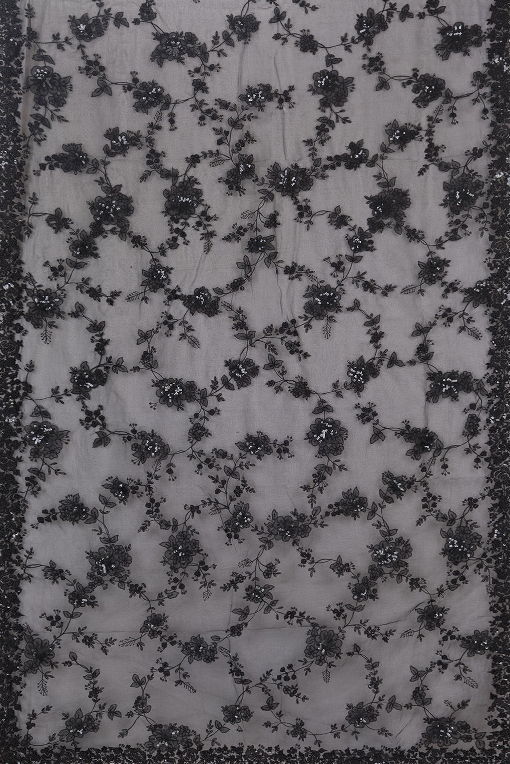 Flat view of Pure Silk Black Organza Saree with Embroidered on the body and Embroidered Border. 