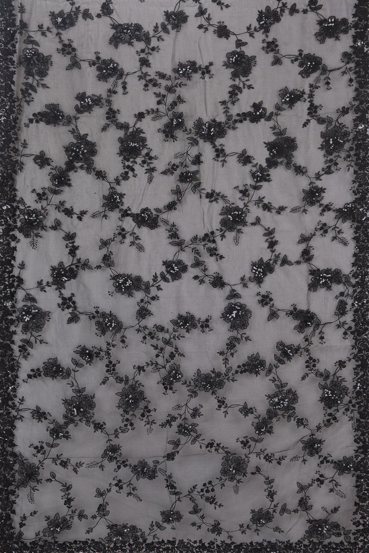 Flat view of Pure Silk Black Organza Saree with Embroidered on the body and Embroidered Border. 