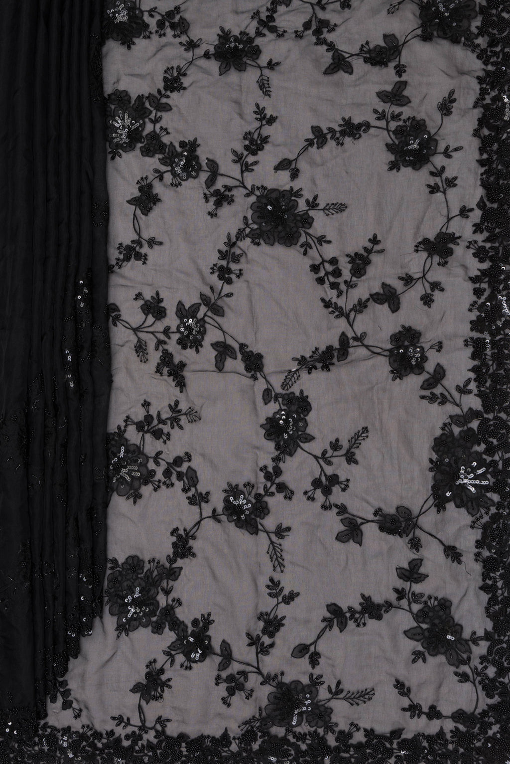 Pleats and pallu of Pure Silk Black Organza Saree with Embroidered on the body and Embroidered Border. 
