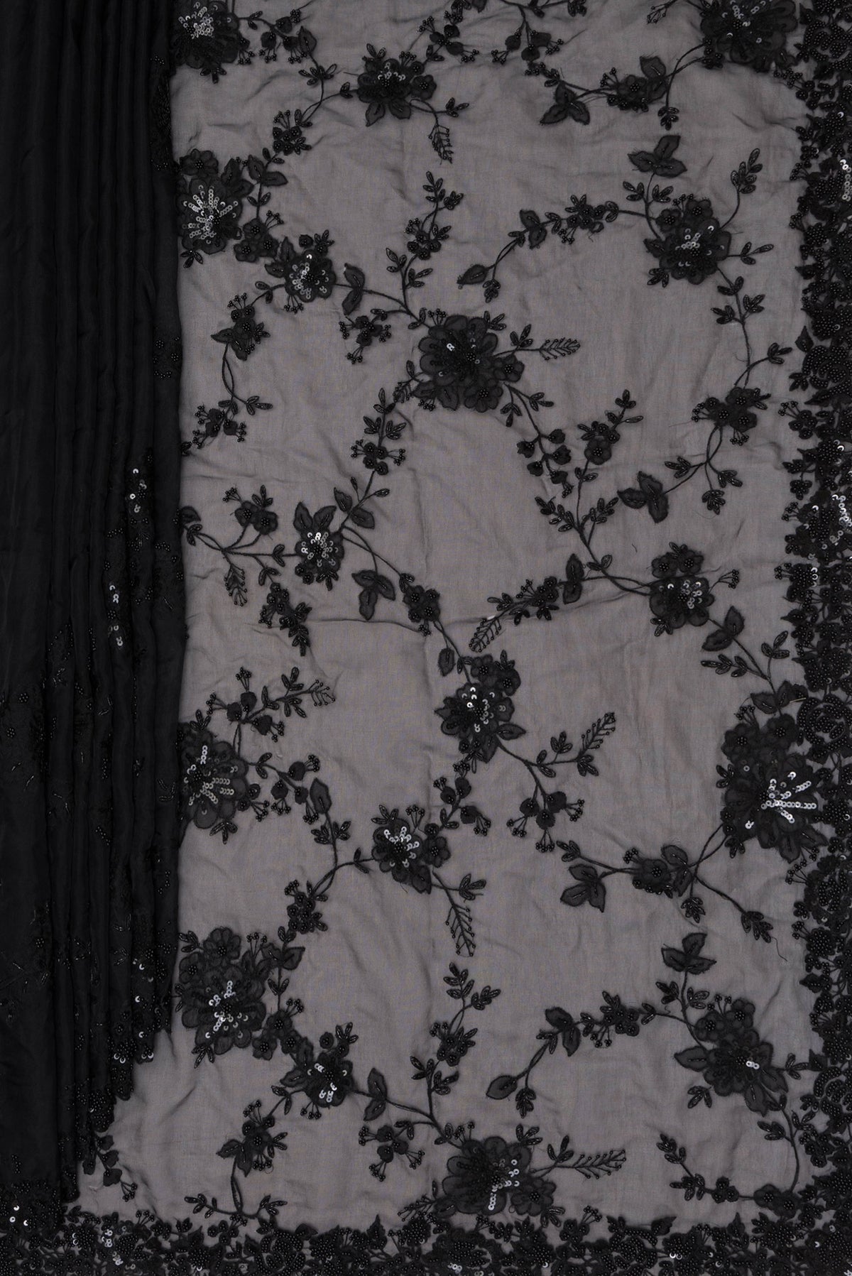 Pleats and pallu of Pure Silk Black Organza Saree with Embroidered on the body and Embroidered Border. 