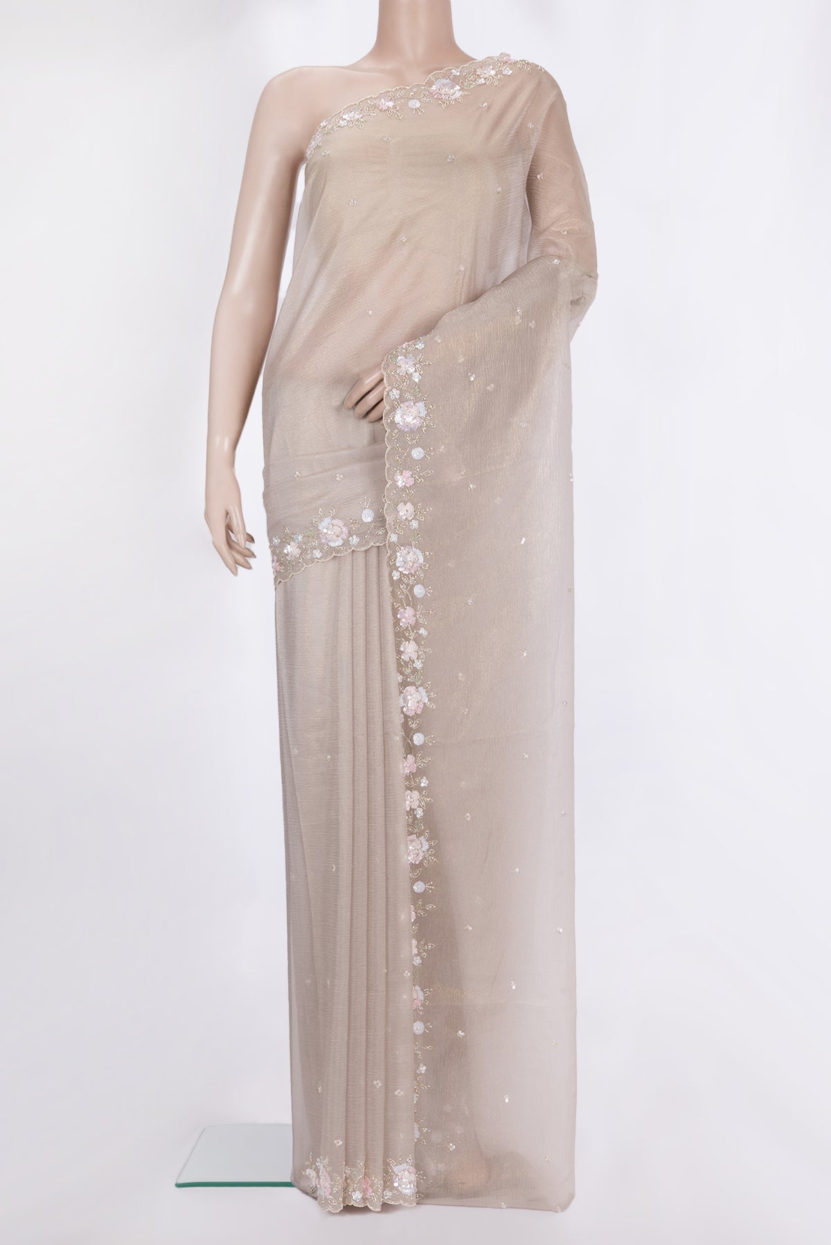Beige Dual Tone Organza Saree with Embroidered on the body and Embroidered Border.  displayed on a mannequin