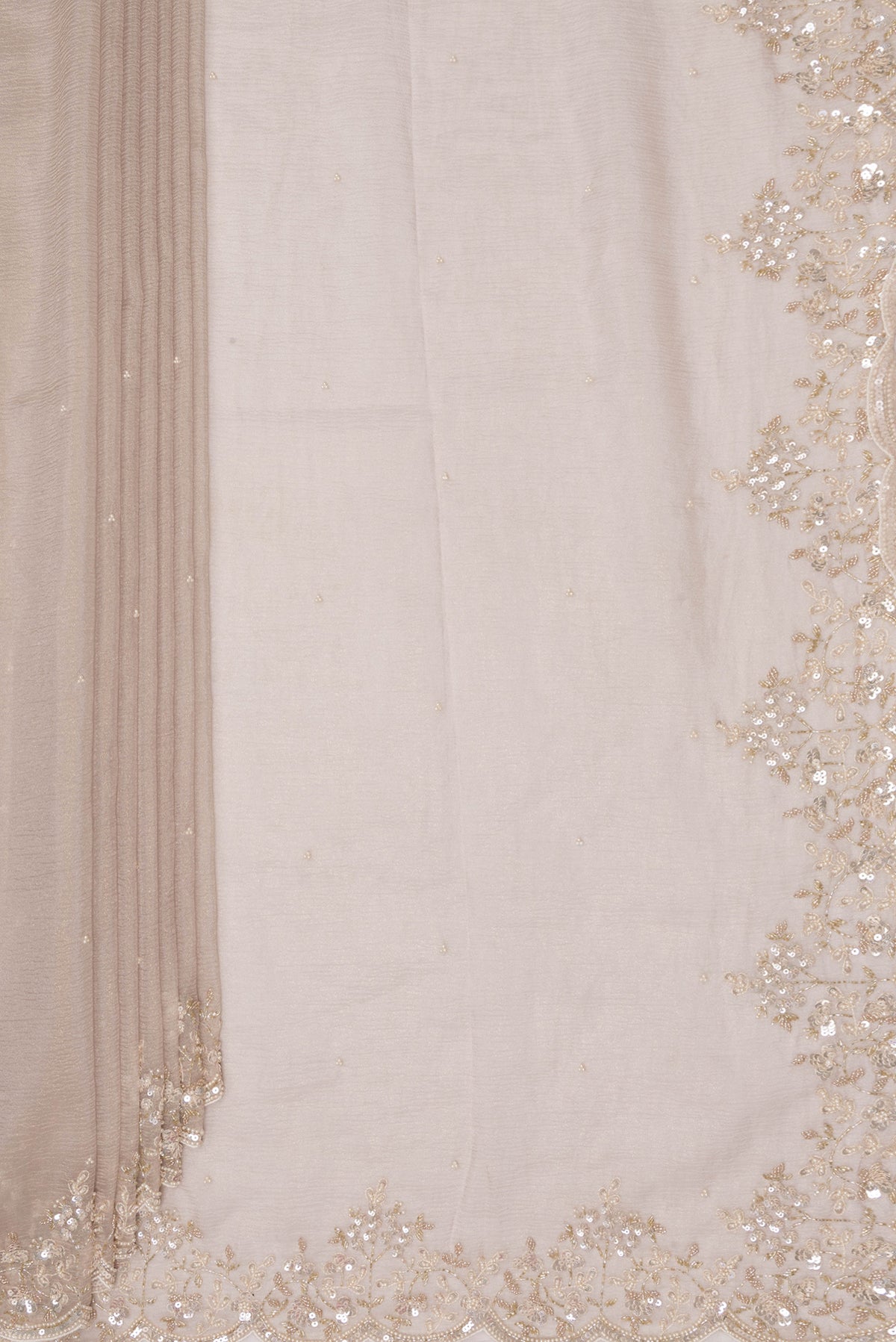 Pleats and pallu of Beige Organza Saree with Embroidered on the body and Embroidered Border. 