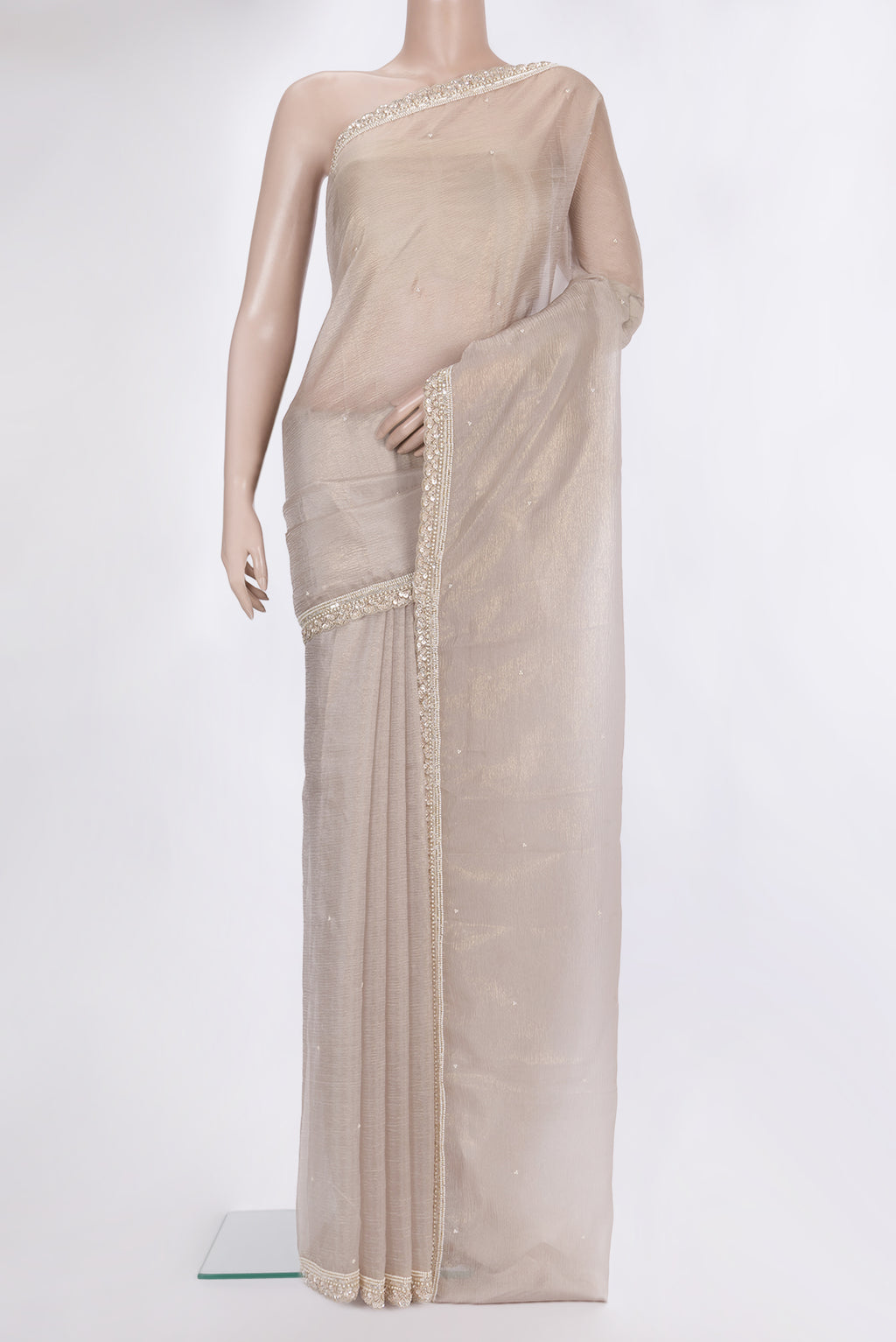 Beige Dual Tone Organza Saree with Embroidered on the body and Sequin Border.  displayed on a mannequin