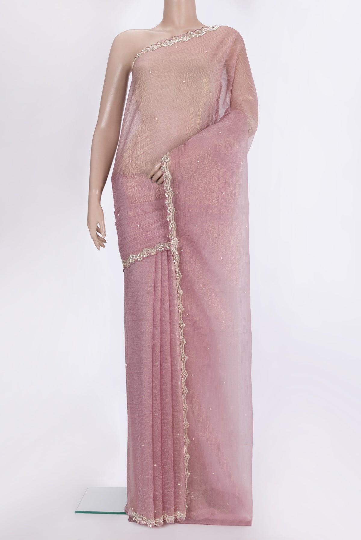 Rose Gold Dual Tone Organza Saree with Embroidered on the body and Embroidered Border.  displayed on a mannequin