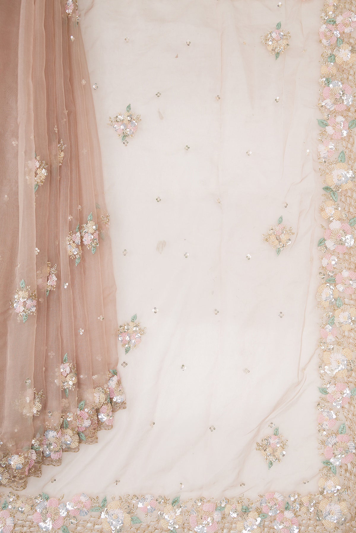 Pleats and pallu of Rose Gold Organza Saree with Embroidered on the body and Sequin Border. 