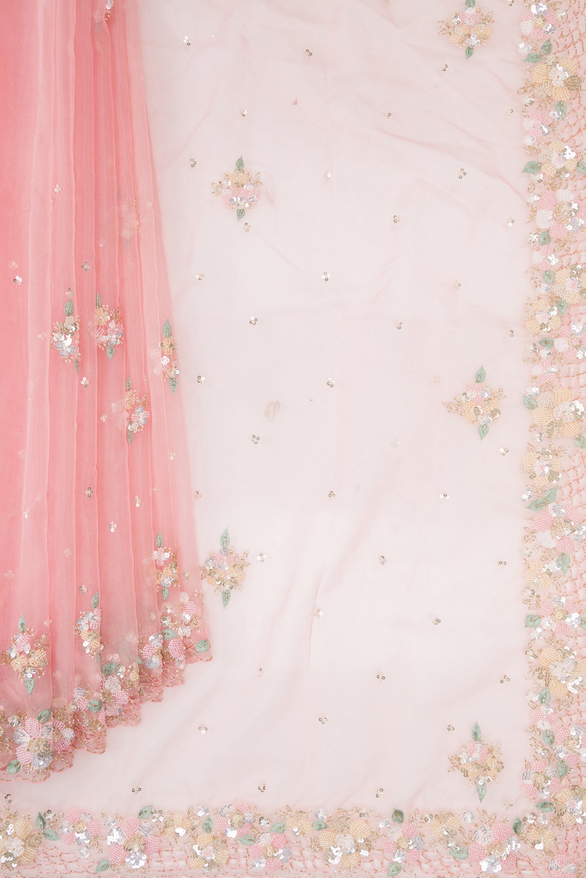 Pleats and pallu of Pink Organza Saree with Embroidered on the body and Embroidered Border. 