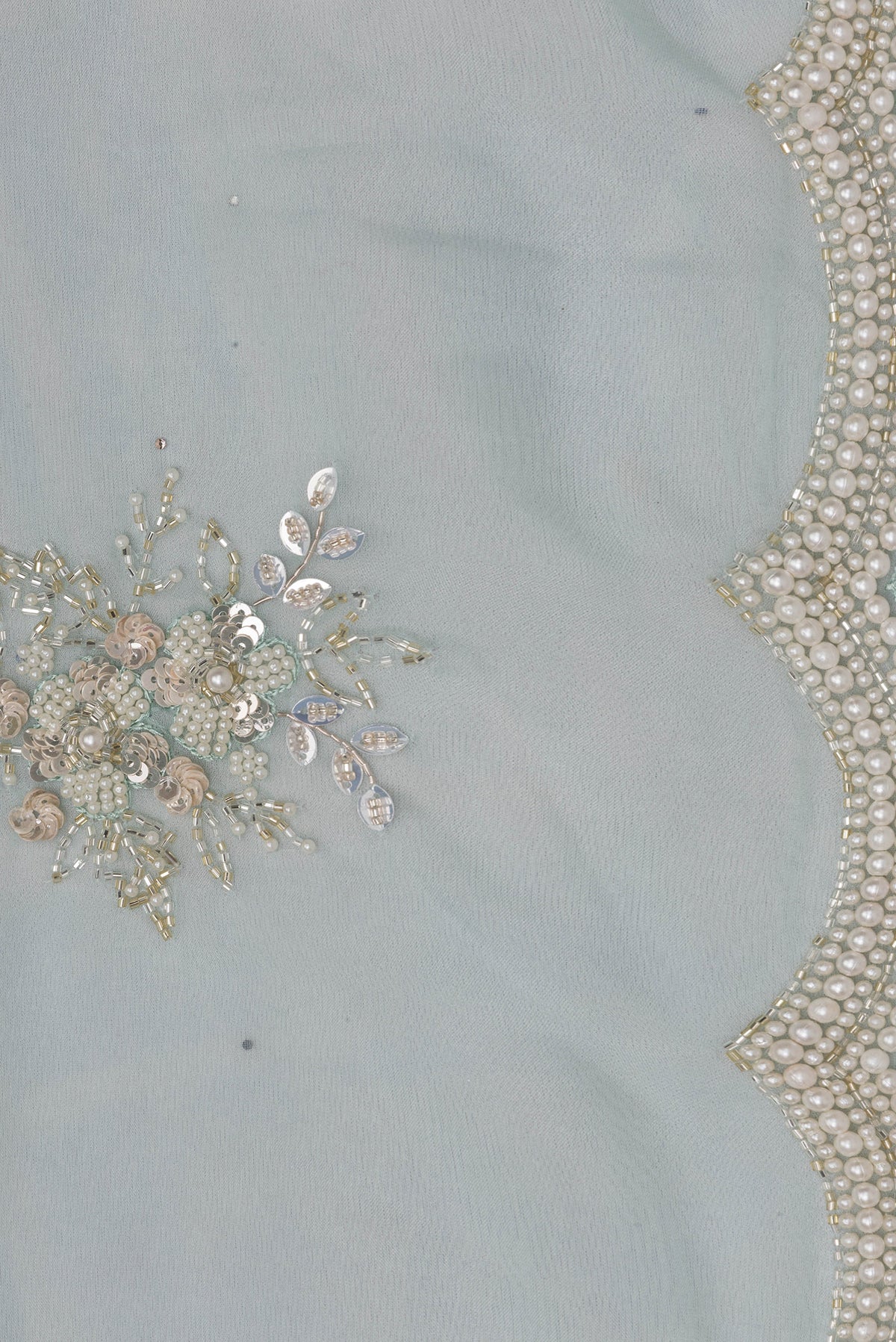 Border image of Pure Silk Light Blue Dual Tone Organza Saree with Embroidery on the body and Sequin Border. 
