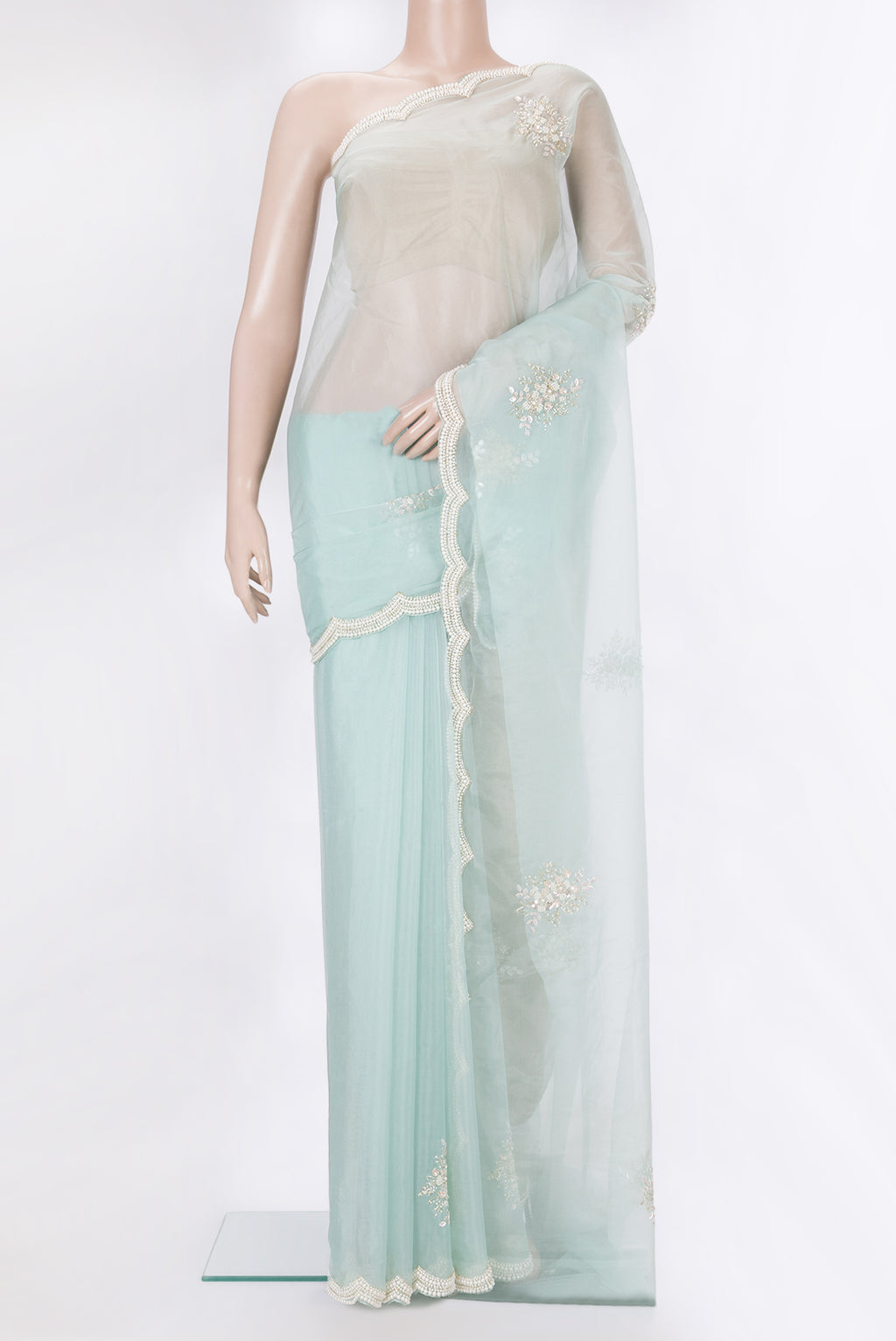 Pure Silk Light Blue Dual Tone Organza Saree with Embroidery on the body and Sequin Border.  displayed on a mannequin