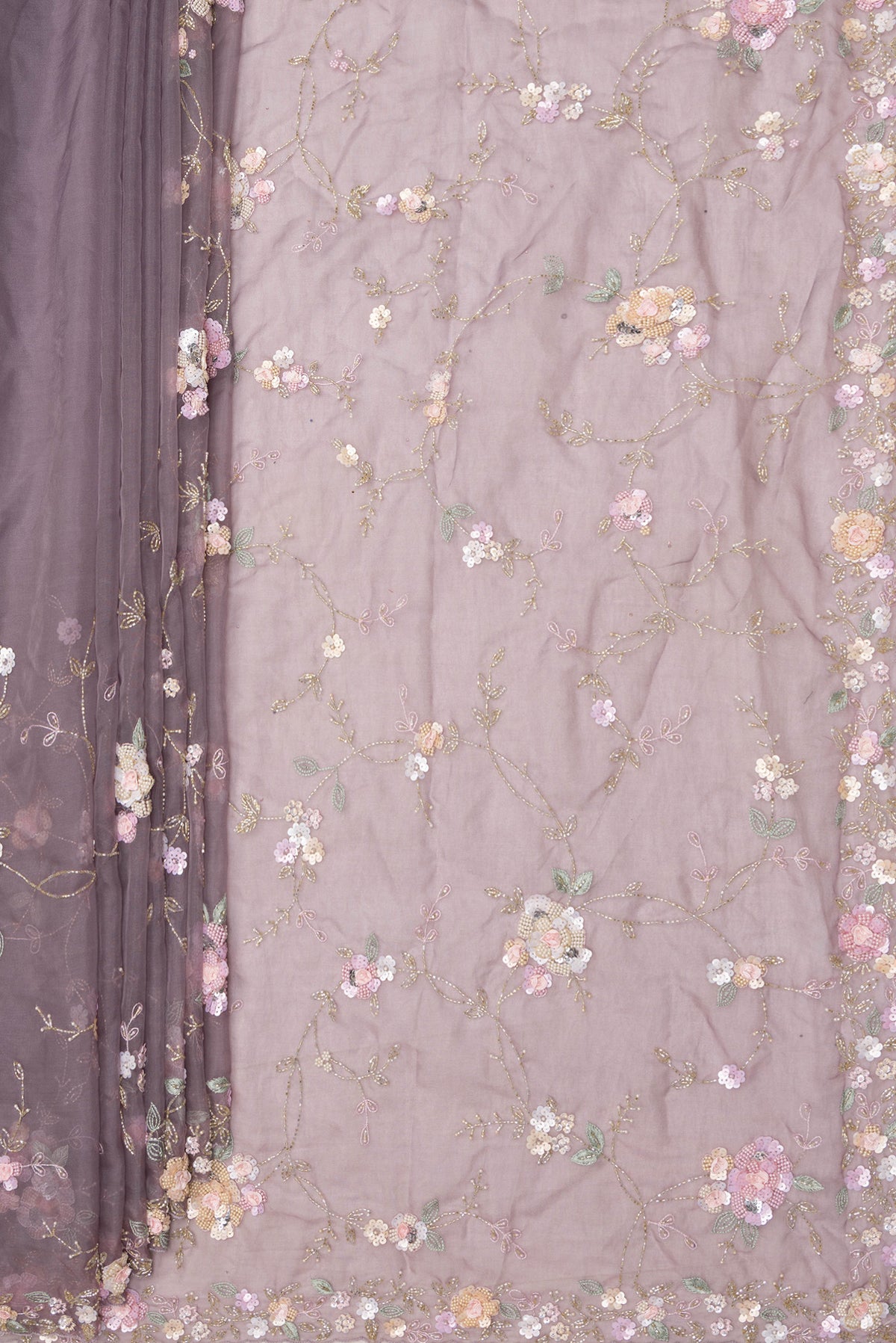Pleats and pallu of Grey Organza Saree with Embroidered on the body and Sequin Border. 