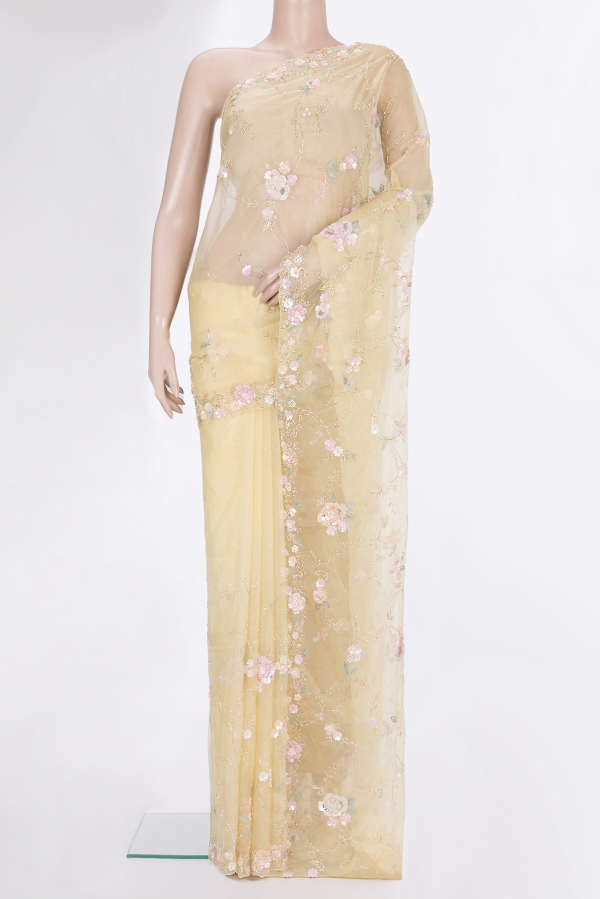 Pure Silk Lemon Yellow Organza Saree with Embroidered on the body and Embroidered Border.  displayed on a mannequin