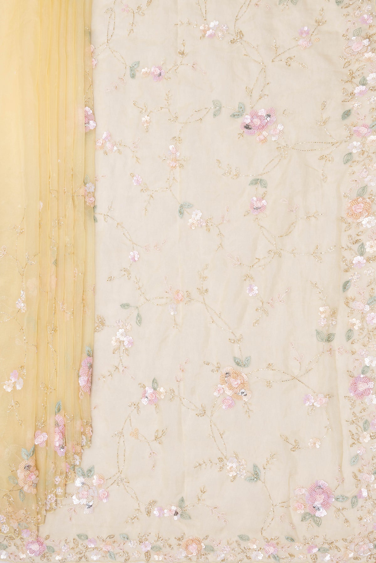 Pleats and pallu of Pure Silk Lemon Yellow Organza Saree with Embroidered on the body and Embroidered Border. 