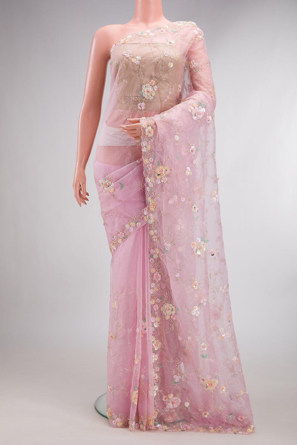 Pure Silk Pink Organza Saree with Embroidered on the body and Sequin Border.  displayed on a mannequin