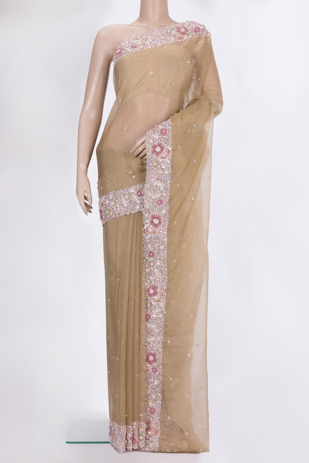 Beige Dual Tone Organza Saree with Embroidered on the body and Sequin Border.  displayed on a mannequin