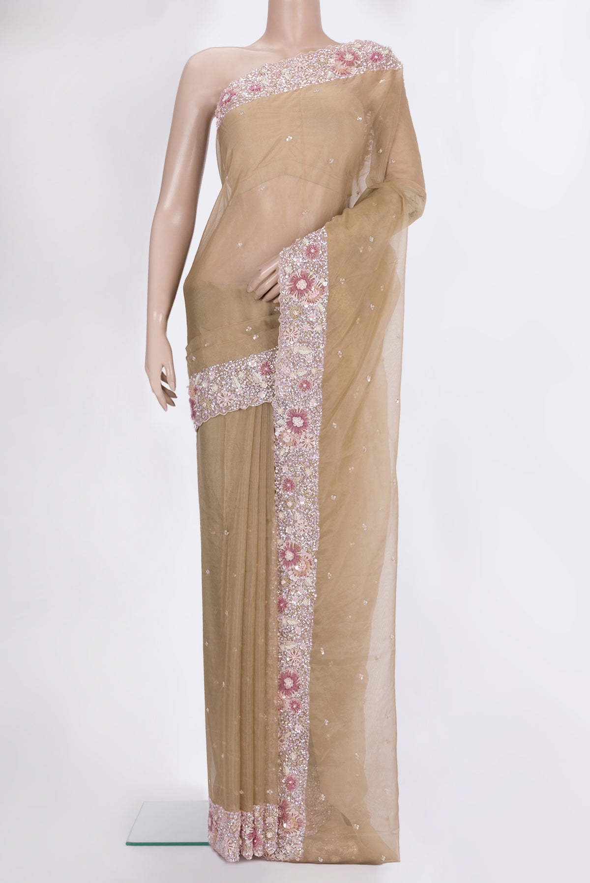 Beige Dual Tone Organza Saree with Embroidered on the body and Sequin Border.  displayed on a mannequin