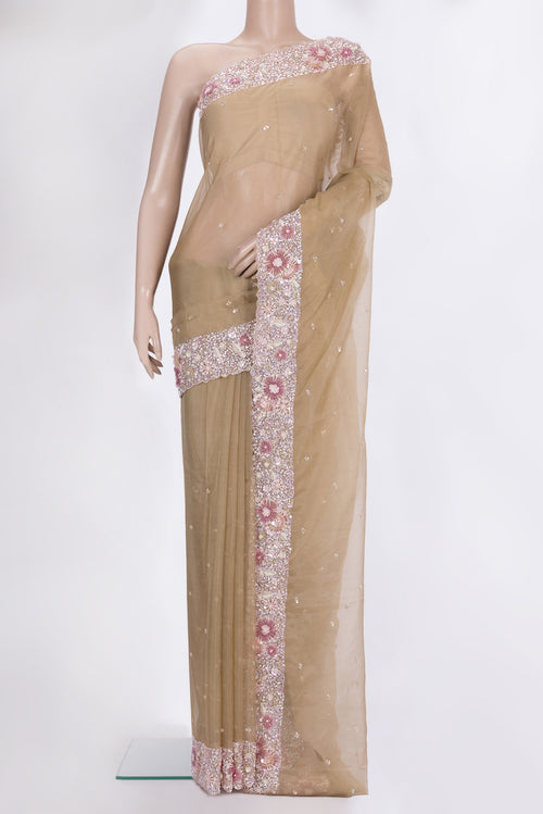Beige Dual Tone Organza Saree with Embroidered on the body and Sequin Border.  displayed on a mannequin