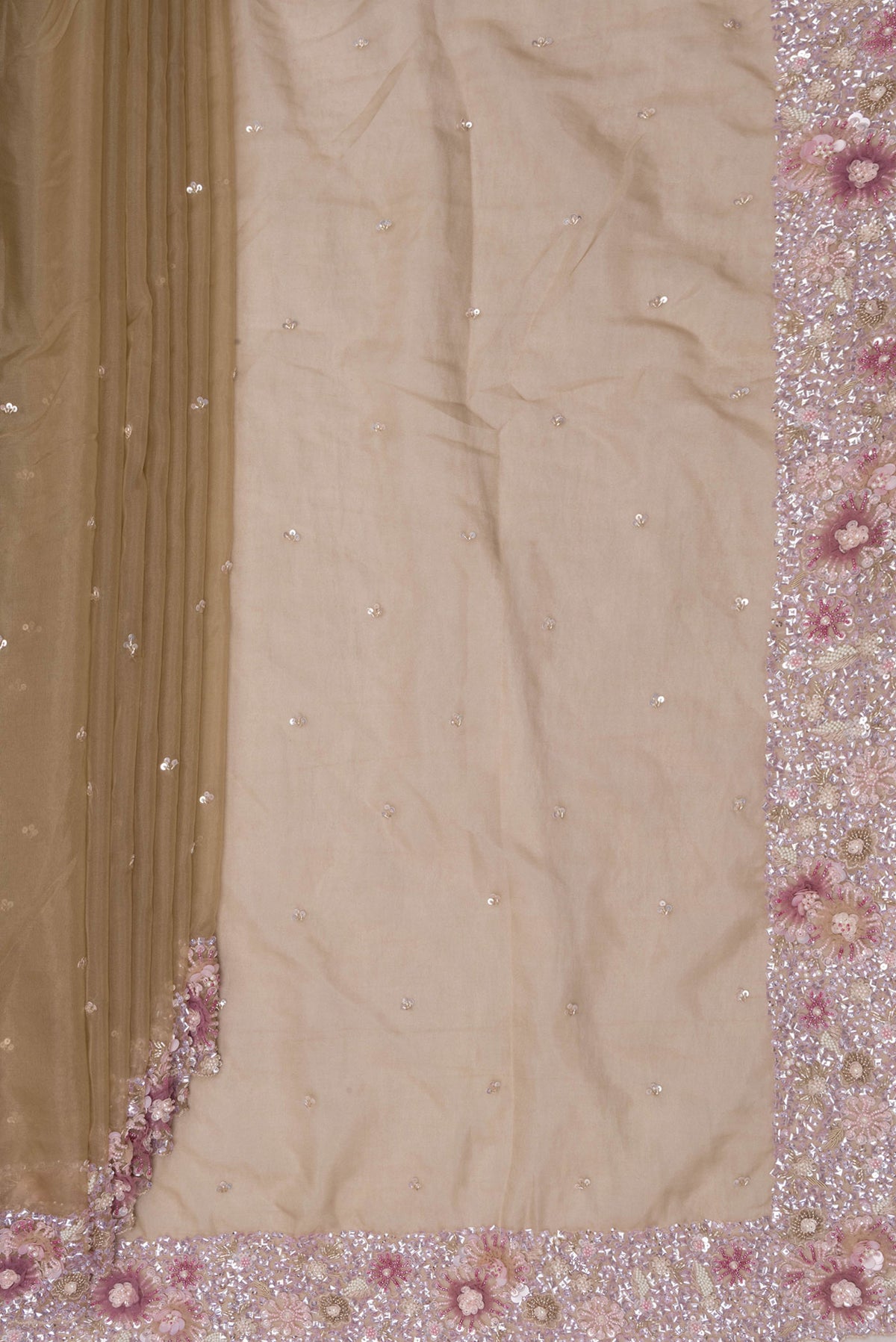 Pleats and pallu of Beige Dual Tone Organza Saree with Embroidered on the body and Sequin Border. 