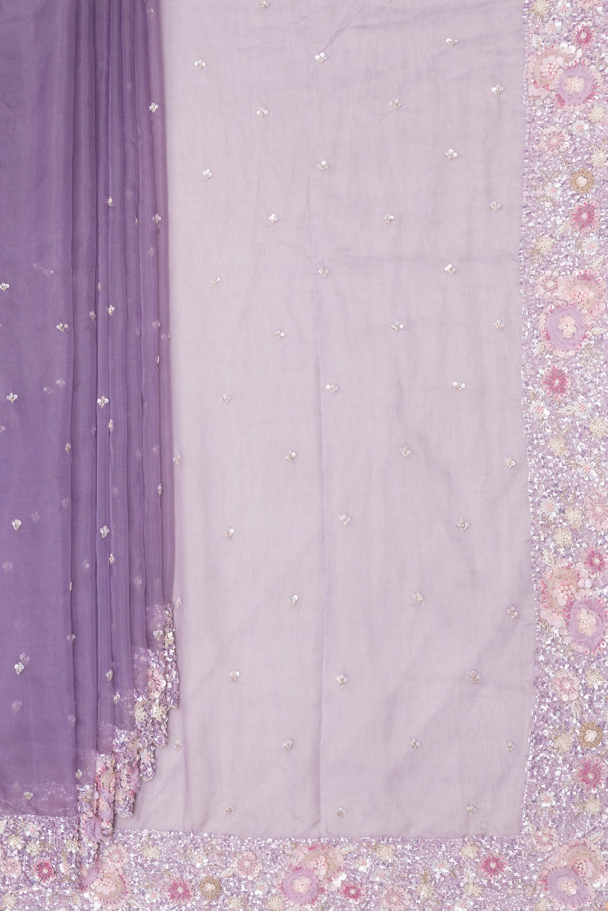 Pleats and pallu of Pure Silk Lavender Dual Tone Organza Saree with Embroidery on the body and Sequin Border. 