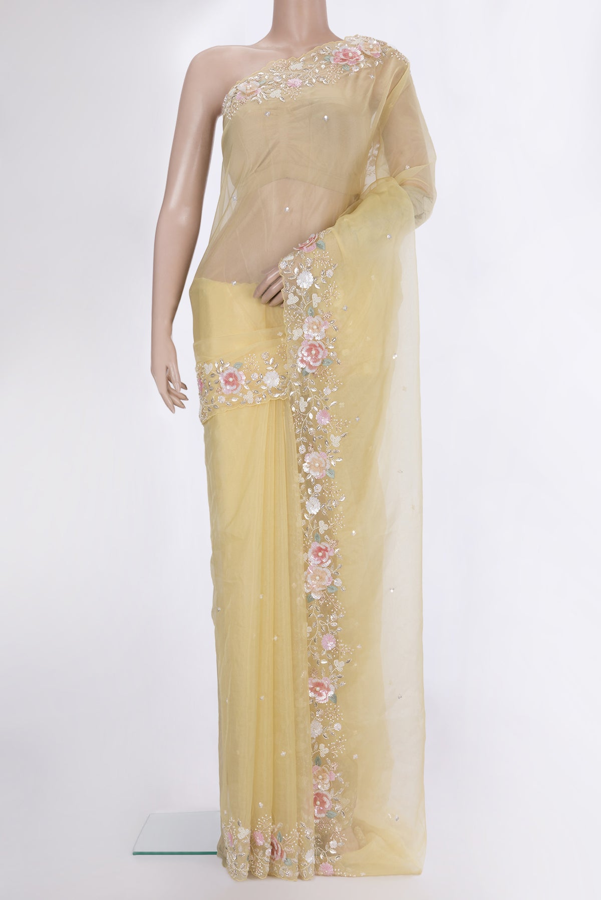 Lemon Yellow Organza Saree with Embroidered on the body and Sequin Border.  displayed on a mannequin