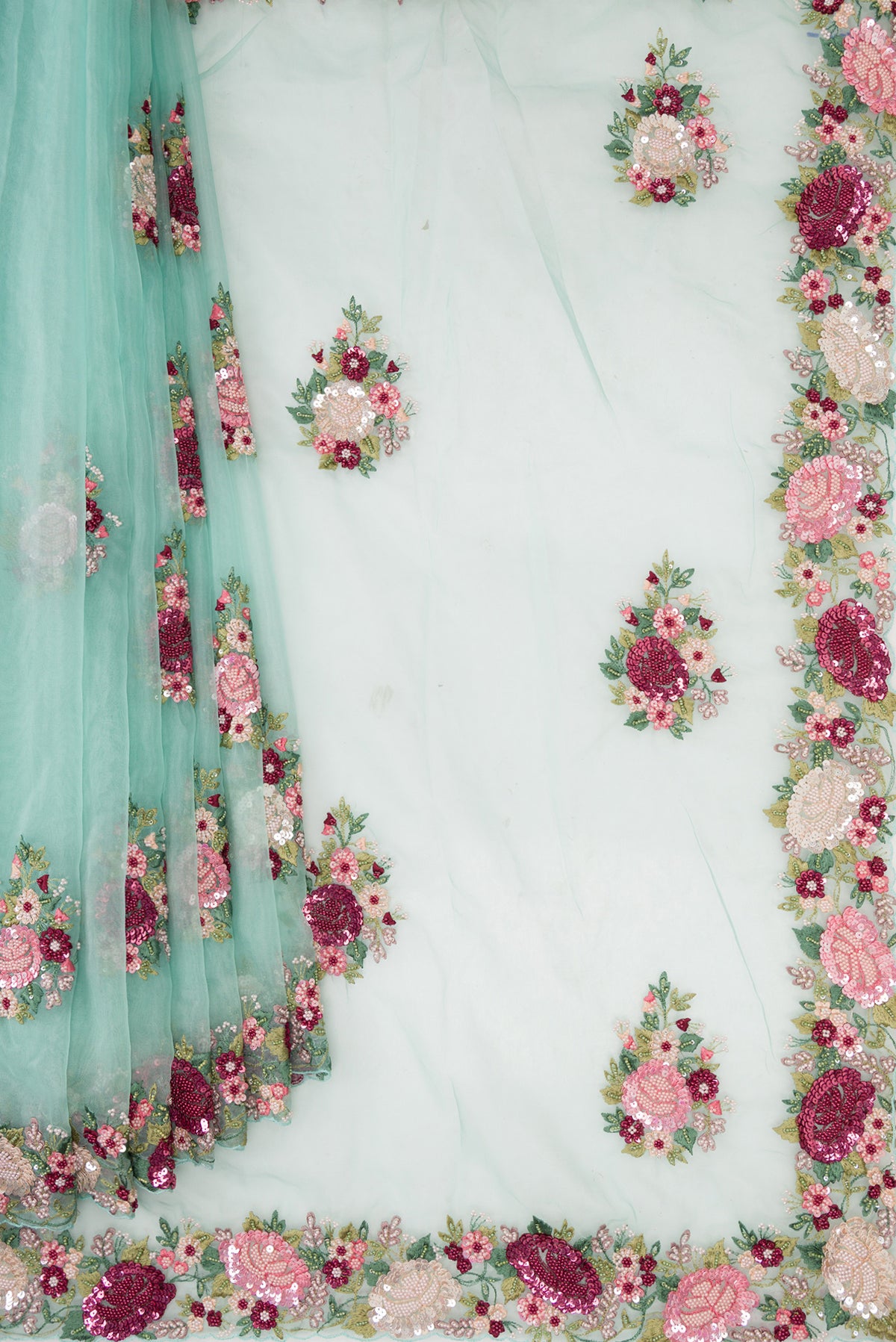 Pleats and pallu of Light Blue Organza Saree with Embroidered on the body and Sequin Border. 