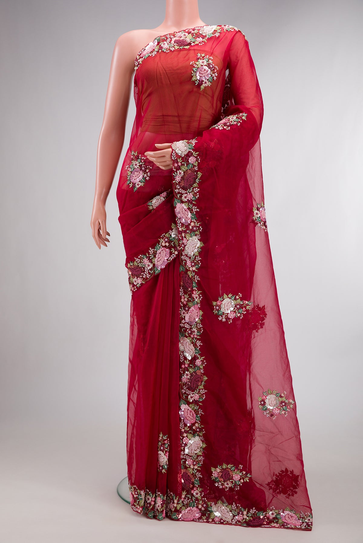 Red Organza Saree with Embroidered on the body and Sequin Border.  displayed on a mannequin