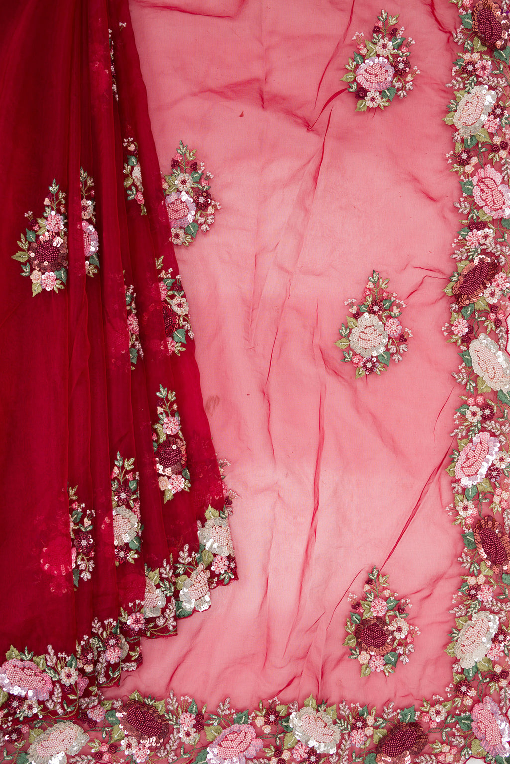 Pleats and pallu of Red Organza Saree with Embroidered on the body and Sequin Border. 