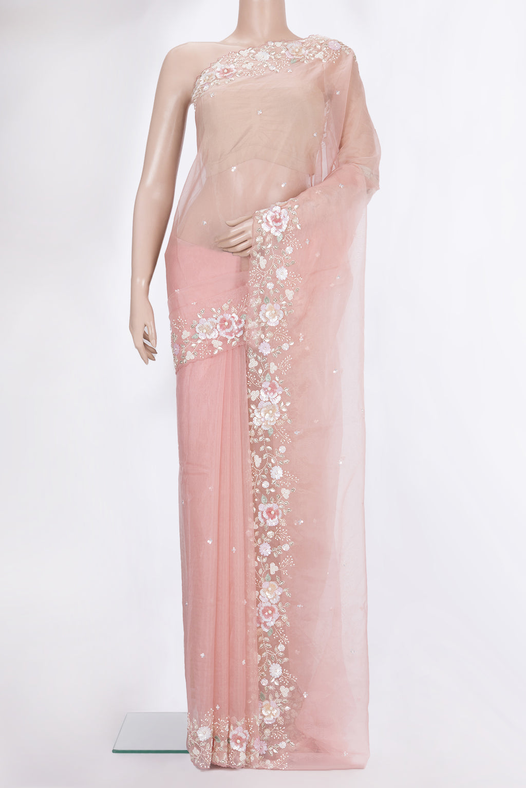 Peach Organza Saree with Embroidered on the body and Sequin Border.  displayed on a mannequin