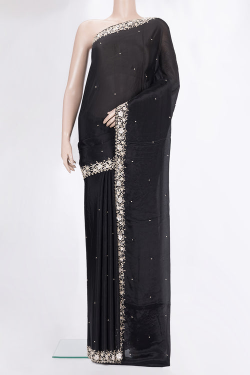 Black Crepe Saree with Embroidered on the body and Embroidered Border.  displayed on a mannequin