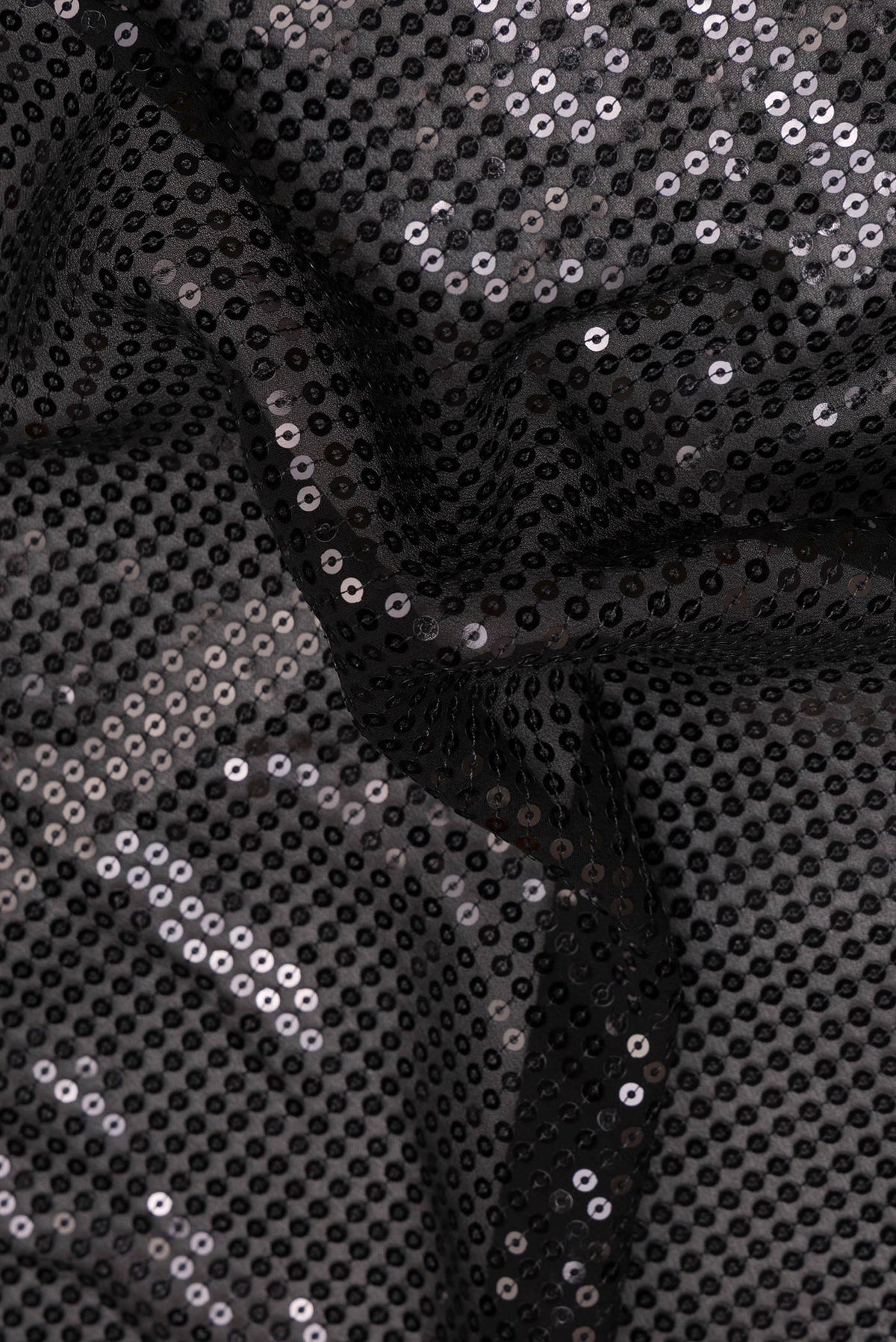 Close up of Black Georgette Saree with Embroidered on the body and Embroidered Border.  displaying folds