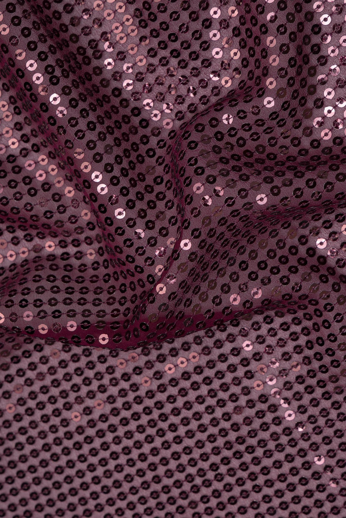 Close up of Burgundy Dual Tone Georgette Saree with Embroidery on the body and Sequin Border.  displaying folds