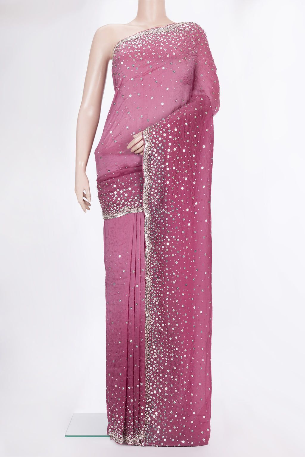 Magenta Organza Saree with Embroidered on the body and Sequin Border.  displayed on a mannequin