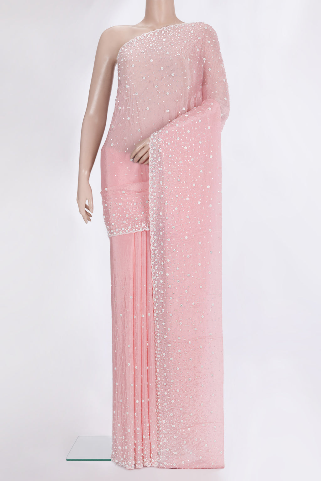 Pink Organza Saree with Embroidered on the body and Sequin Border.  displayed on a mannequin