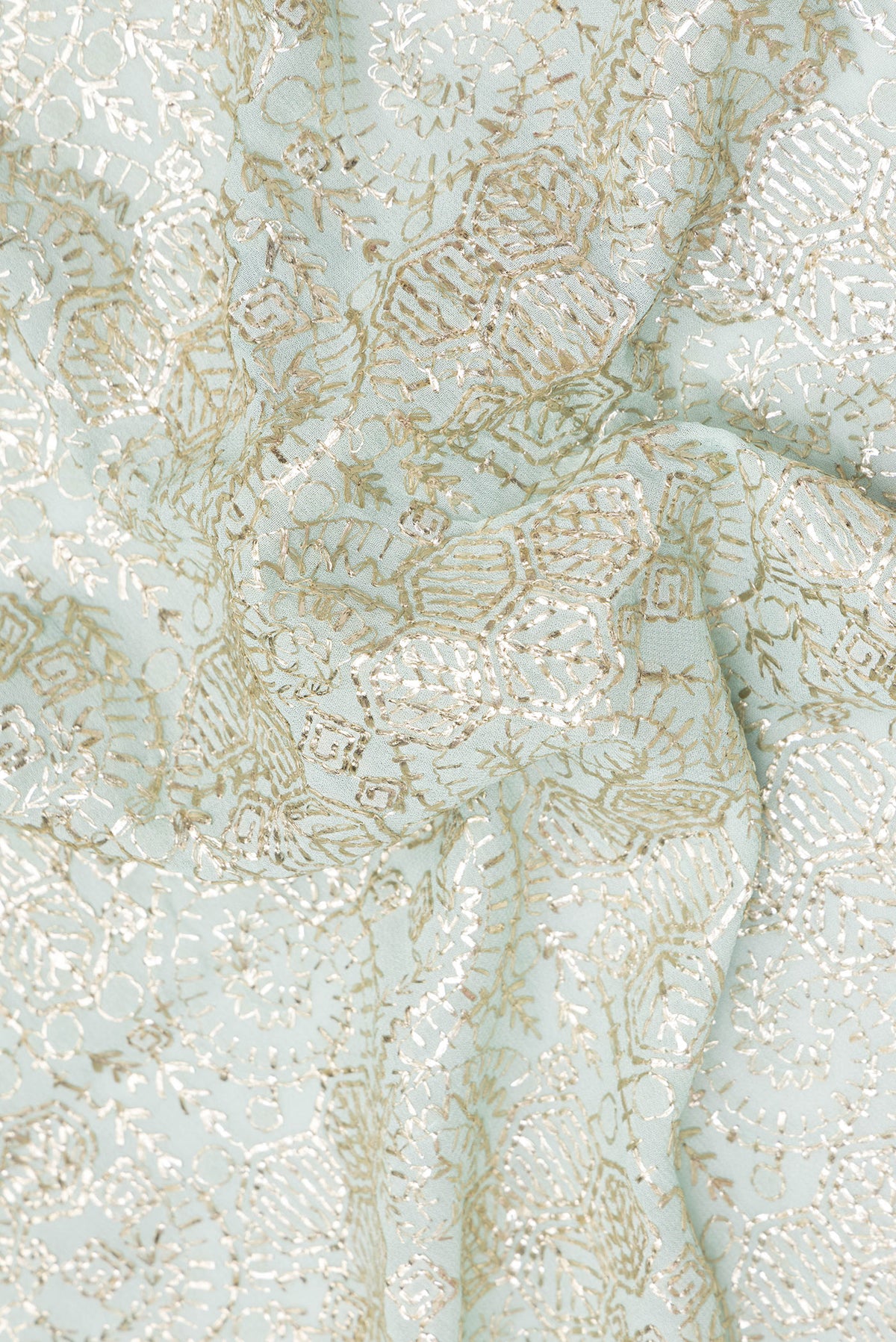 Close up of Light Blue Dual Tone Georgette Saree with Embroidery on the body and Sequin Border.  displaying folds
