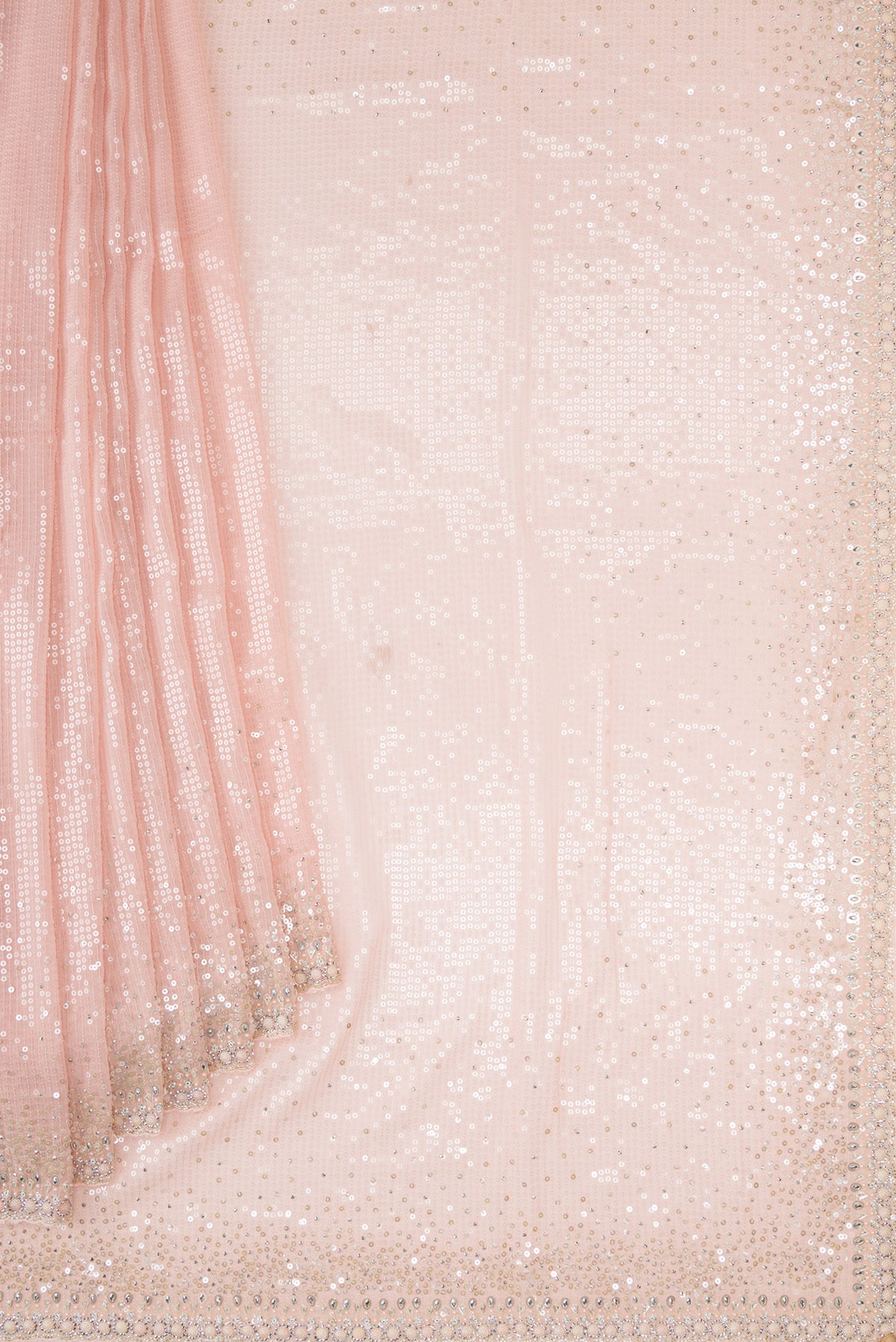 Pleats and pallu of Golden Peach Georgette Saree with Embroidered on the body and Sequin Border. 