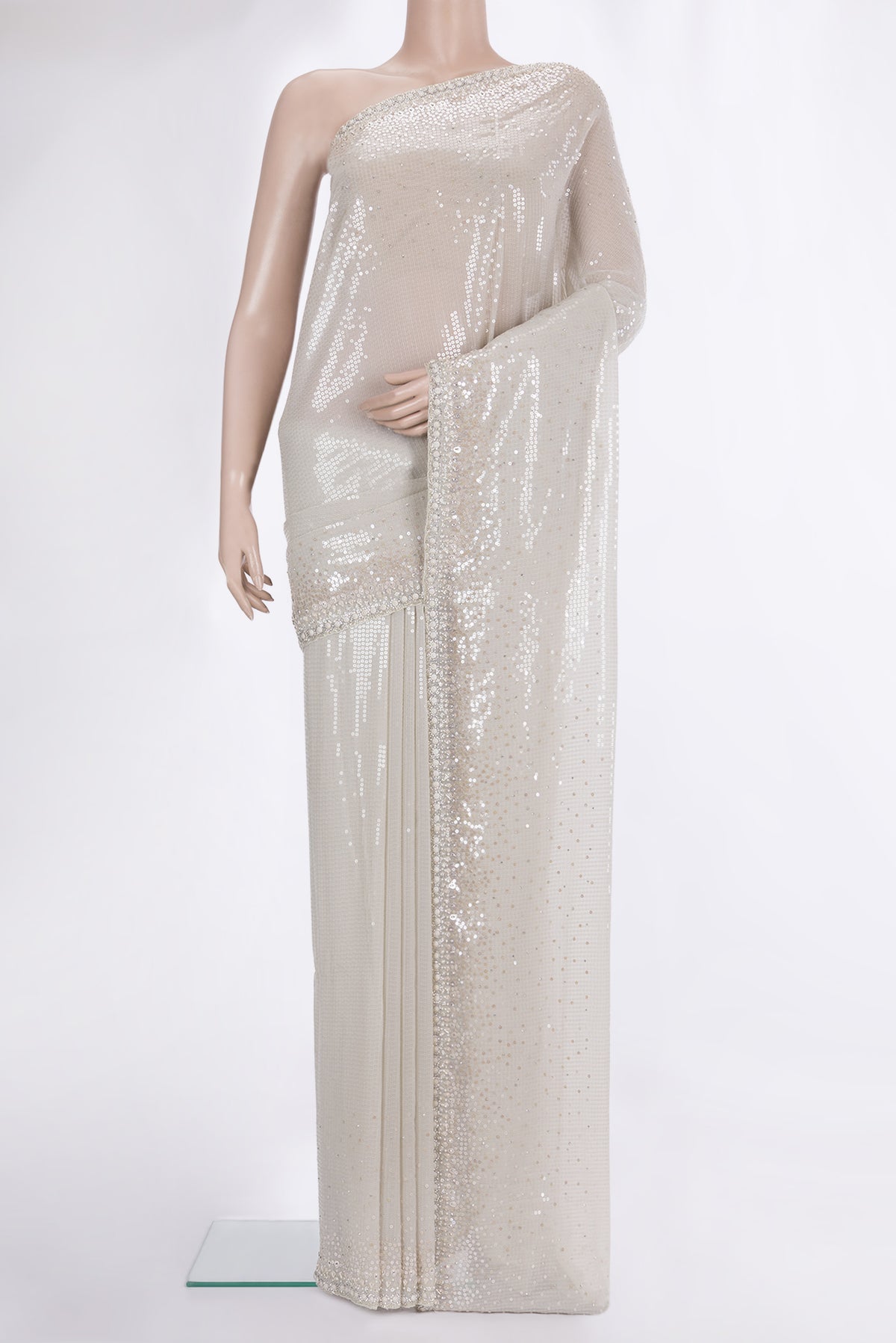 Cream Georgette Saree with Embroidered on the body and Sequin Border.  displayed on a mannequin