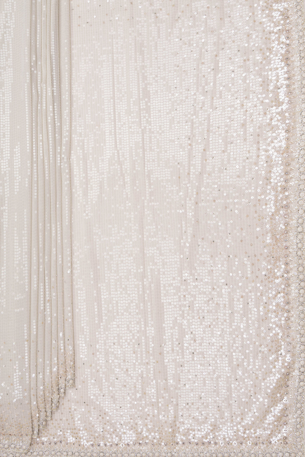 Pleats and pallu of Cream Georgette Saree with Embroidered on the body and Sequin Border. 