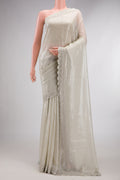 Beige Dual Tone Mysore Georgette Saree with Embroidered on the body and Sequin Border.  displayed on a mannequin