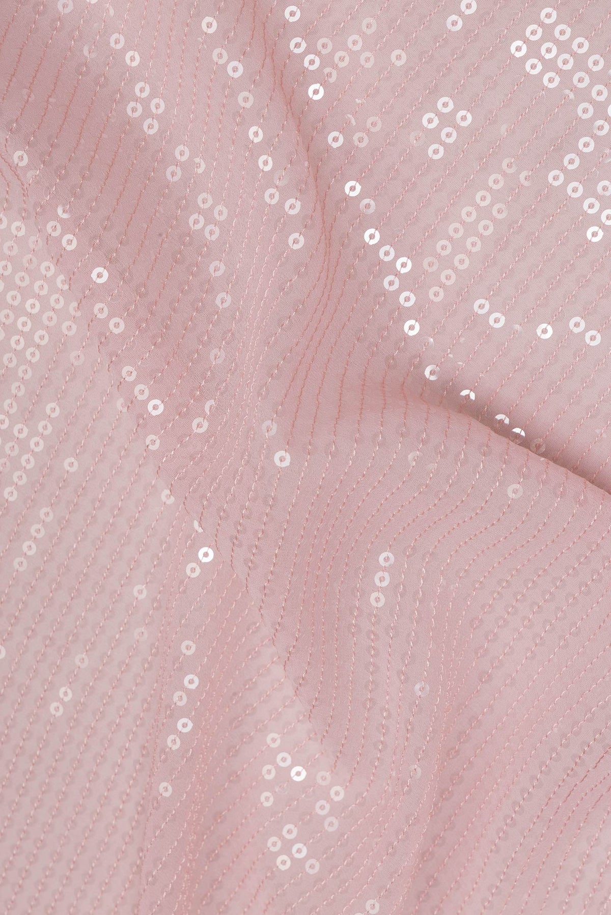 Close up of Rose pink Georgette Saree with Embroidered on the body and Embroidered Border.  displaying folds