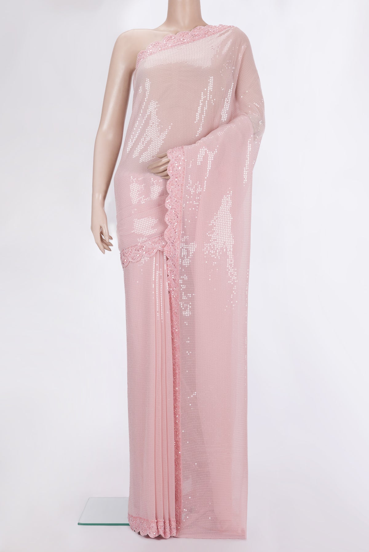 Rose pink Georgette Saree with Embroidered on the body and Embroidered Border.  displayed on a mannequin