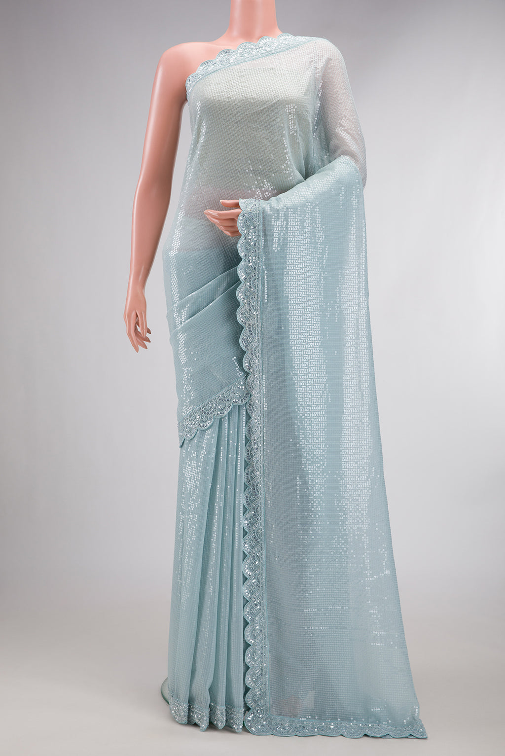 Grey Dual Tone Mysore Georgette Saree with Embroidered on the body and Sequin Border.  displayed on a mannequin
