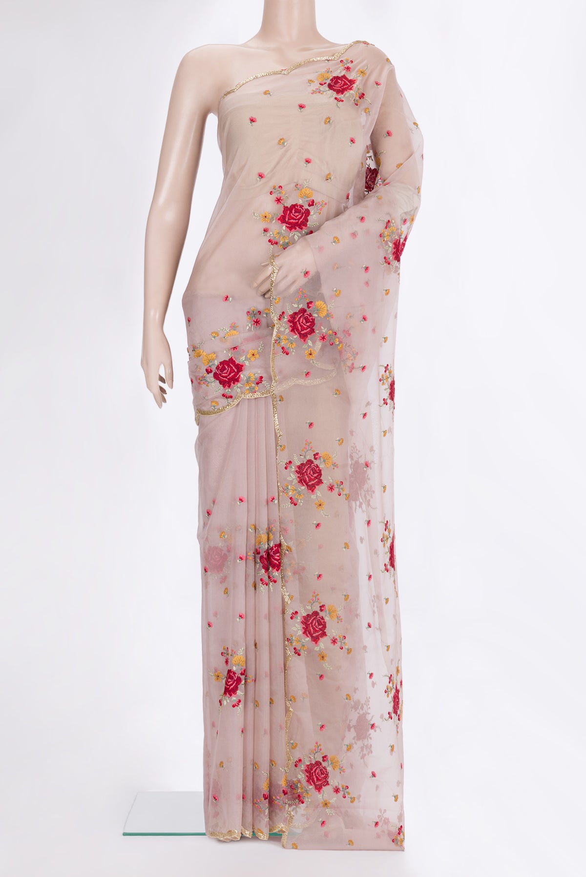 Rose Gold Organza Saree with Embroidered on the body and Embroidered Border.  displayed on a mannequin