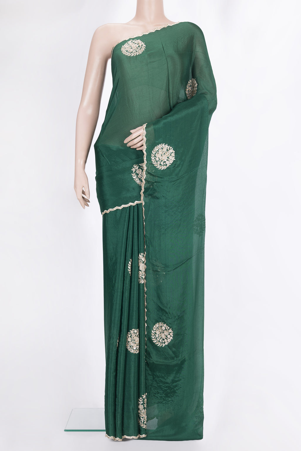Bottle Green Crepe Saree with Embroidered on the body and Sequin Border.  displayed on a mannequin