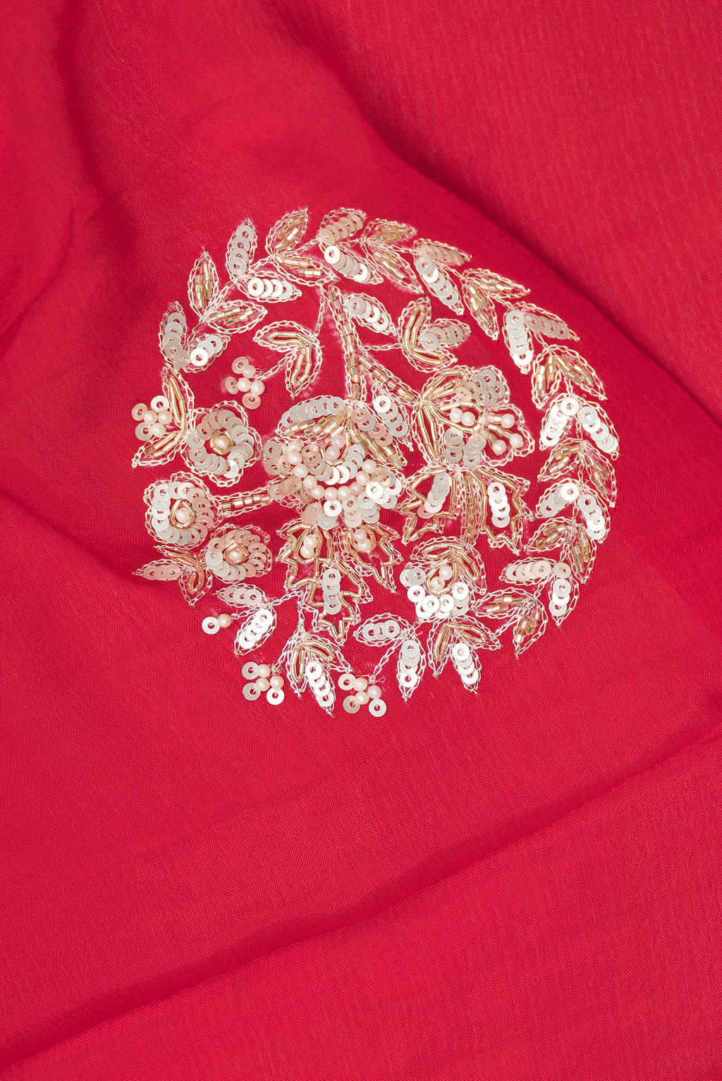 Close up of Red Crepe Saree with Embroidered on the body and Sequin Border.  displaying folds