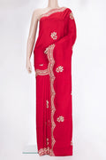Red Crepe Saree with Embroidered on the body and Sequin Border.  displayed on a mannequin