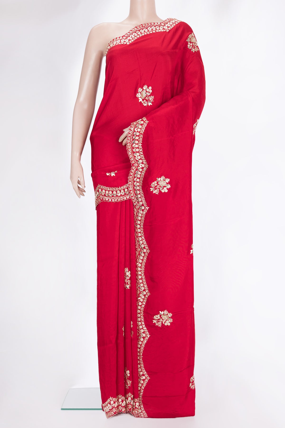 Red Crepe Saree with Embroidered on the body and Sequin Border.  displayed on a mannequin