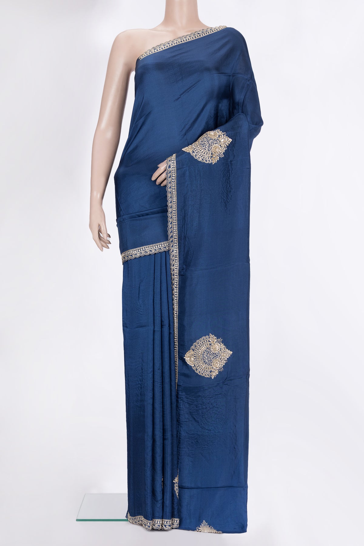 Peacock Blue Crepe Saree with Embroidered on the body and Embroidered Border.  displayed on a mannequin